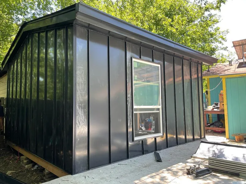 Black standing seam metal wall panels for Roof Inspection in Toronto